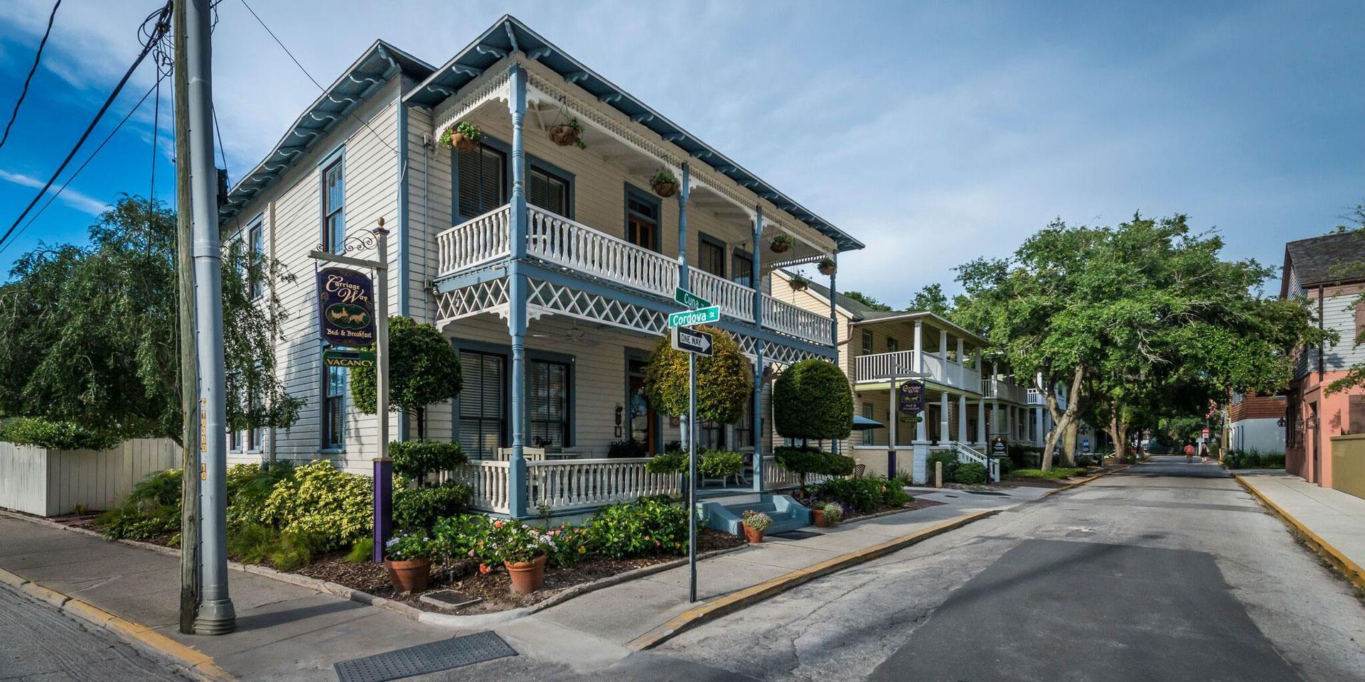 Carriage Way Inn — daytime view from the corner of Cuna and Cordova