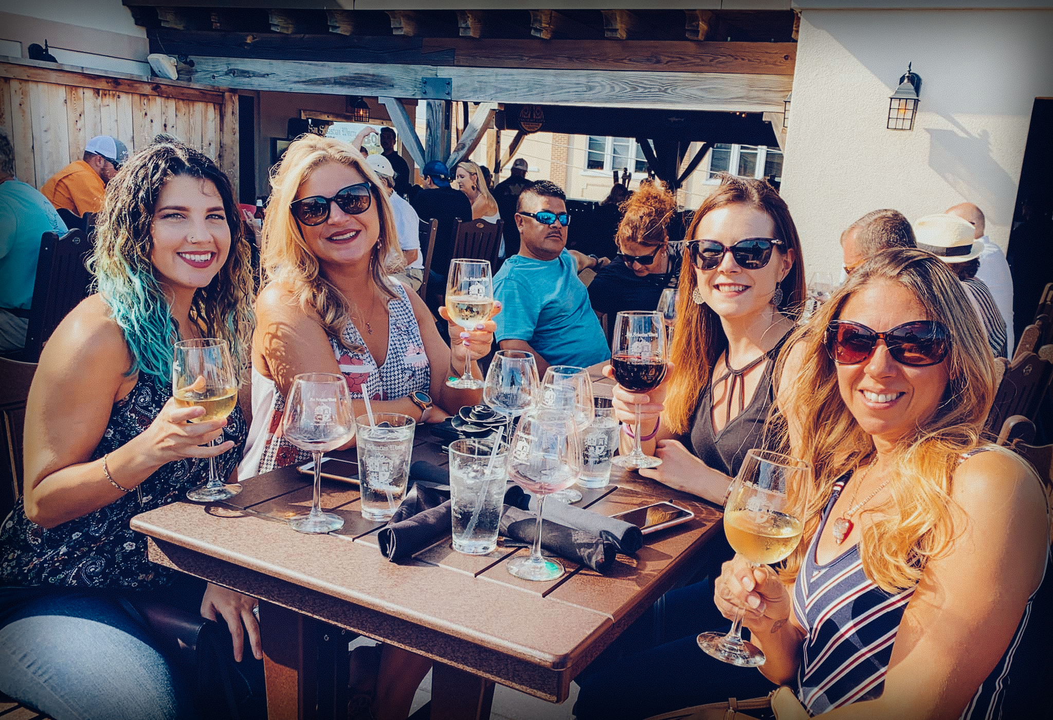 Group picture of friends enjoying wine at The San Sebastian Winery