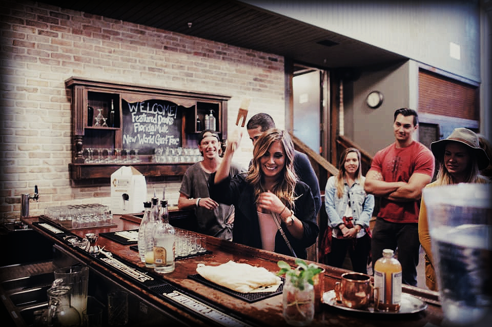 Gathering of people enjoying the St. Augustine Distillery