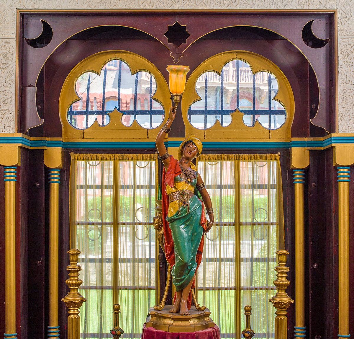 Painted statute of a woman inside the Villa Zorayda Museum
