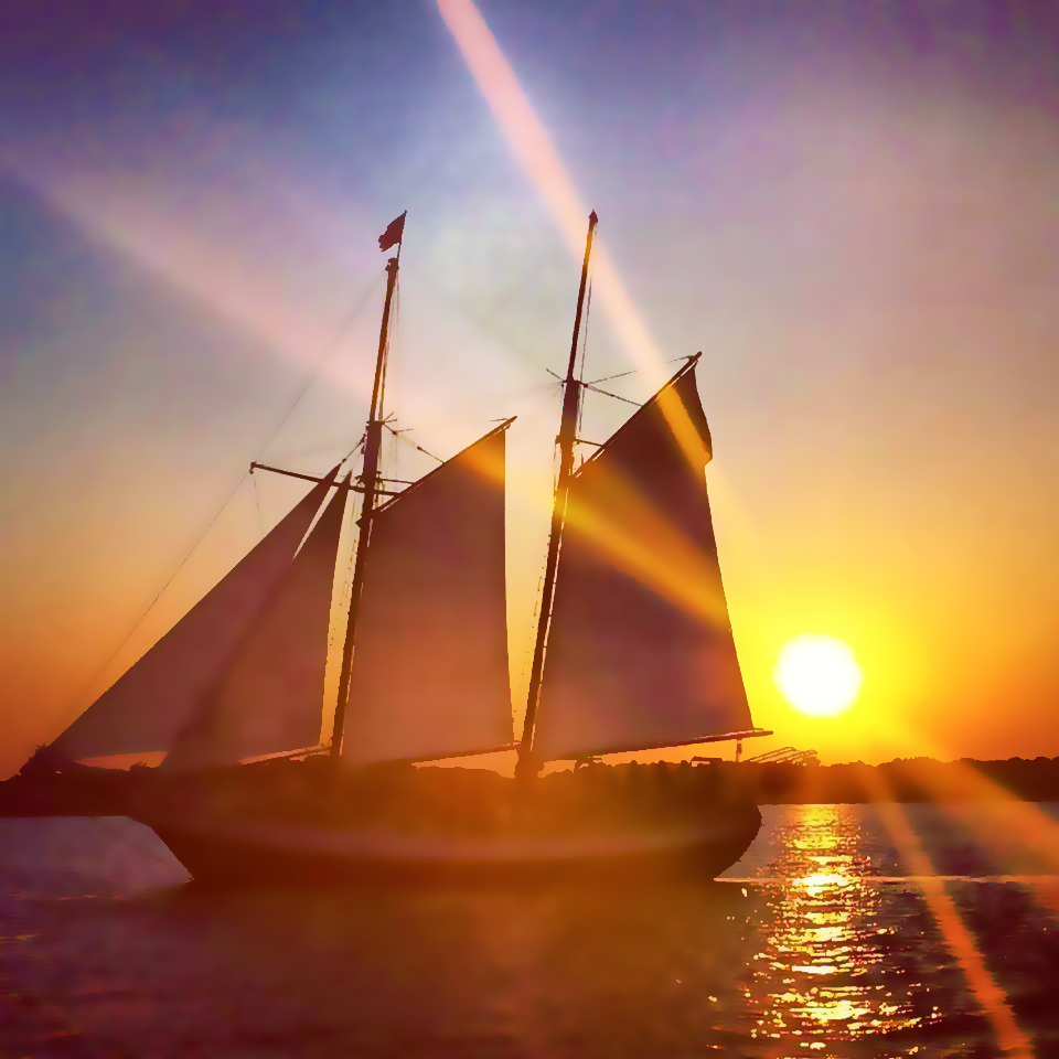 Sunset view looking at the Schooner Freedom sailing