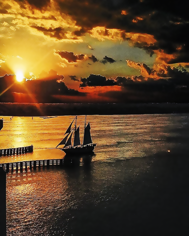 Sunset view looking at the Schooner Freedom sailing